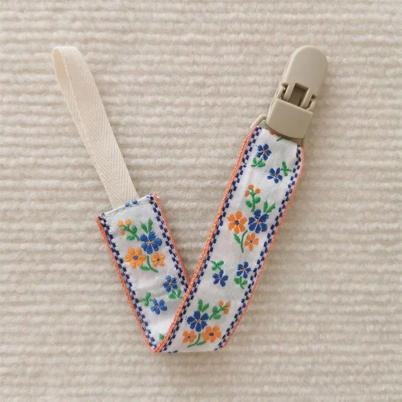 Attache tetine innovant bleu et orange