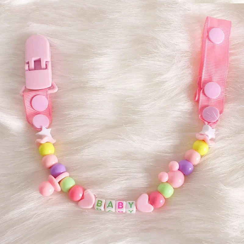 Attache tetine securibebe rose avec des perles