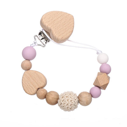 Attache tetine securisee et coloree rose clair