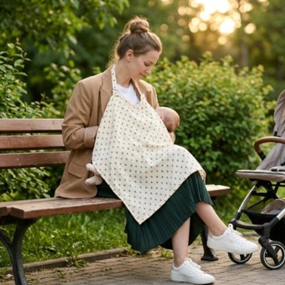 Cape d allaitement discrete maman allaite bebe sur un banc au parc