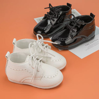 chaussure bebe noires et blanches